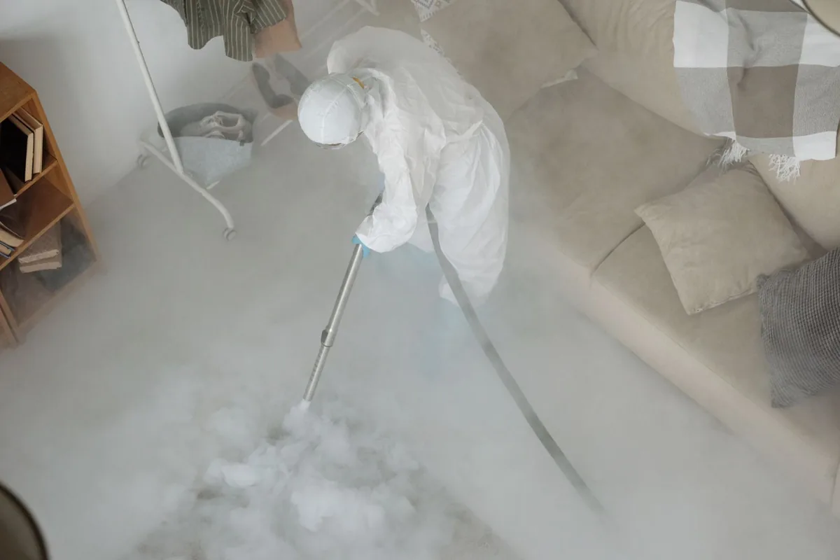 Biohazard cleanup technician in protective equipment, Garrison Park, Austin, TX